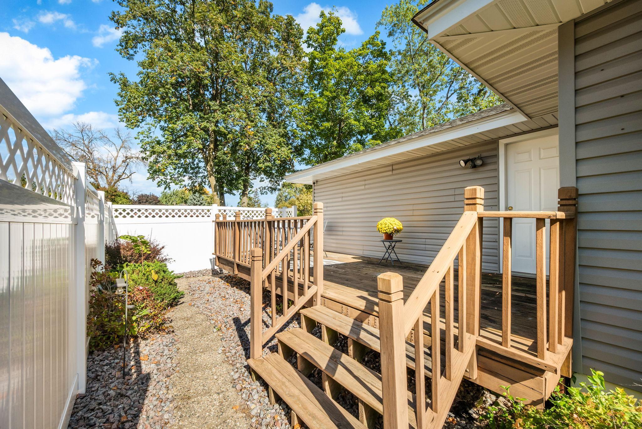 Nice deck off kitchen and garage with a private side yard - perfect for entertaining!