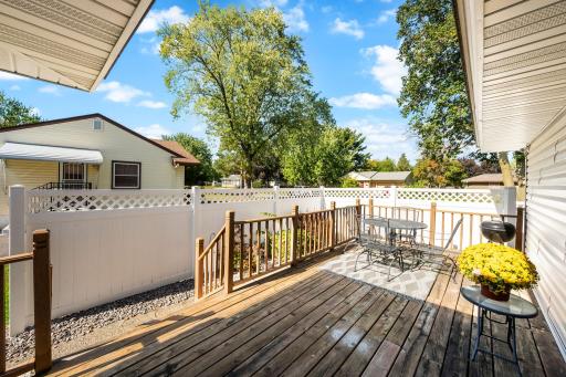 Nice deck off kitchen and garage with a private side yard - perfect for entertaining!