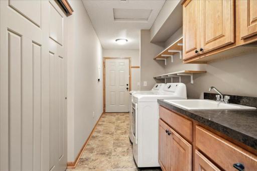 Large Laundry Area with Plenty of Space for Coats and Shoes at the Garage Entrance!