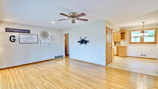 Living room. Dining area and kitchen to the right.