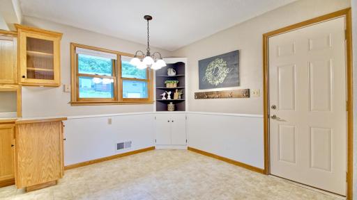 Dining area. Doorway on the right leads to attached 1 car garage.