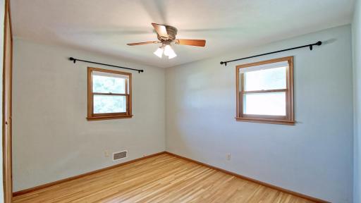 Main level bedroom located on the back right corner of the home. Oak hardwood floors.