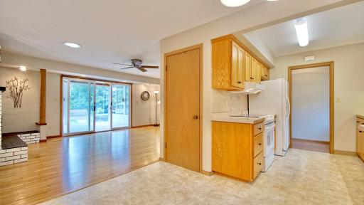 Living room straight ahead with glass doors leading to three season porch.