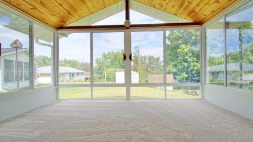 Three season porch looking out to backyard. Brand new carpet in 2025.