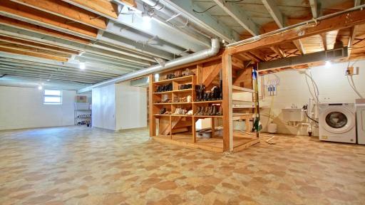Lower level of home. Recreation room to the left. Laundry area to the right.