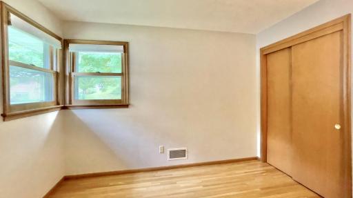 Main level bedroom located on front right corner of home. Oak hardwood floors.