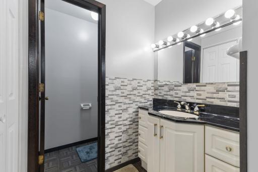 Another beautiful space! The primary bathroom features a spacious vanity with ample storage, an oversized mirror, and a private, separate toilet.