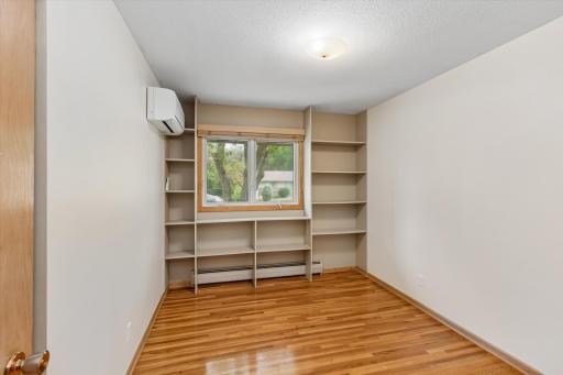 This secondary bedroom features built in shelves.