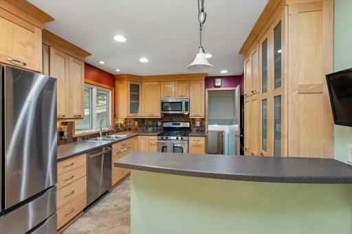 This beautiful kitchen boasts stainless steel appliances.