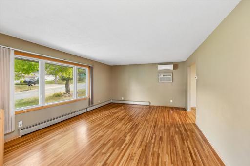 This beautiful living room features hardwood floors and Andersen windows.