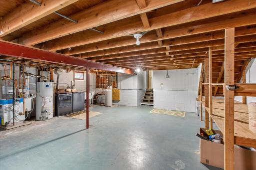 The basement houses utilities, laundry and so much storage space!!!