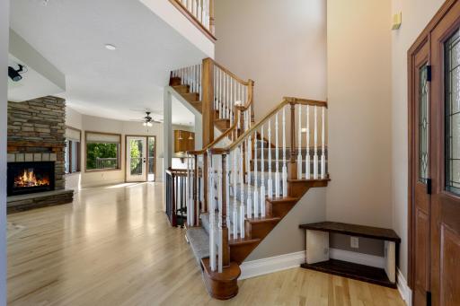 Sunlit foyer & open living with lake views in Lakeville!