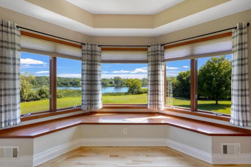 Expansive windows frame stunning waterfront scenery.