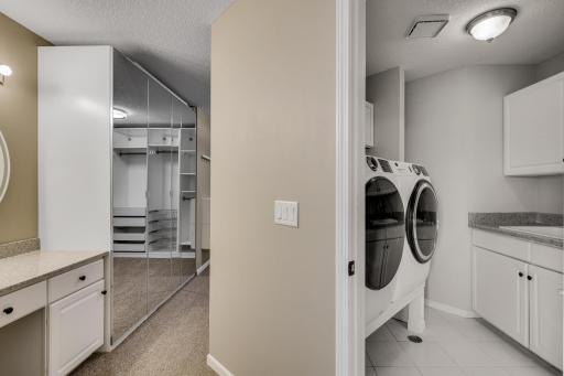 Convenient laundry just steps from your custom closet.