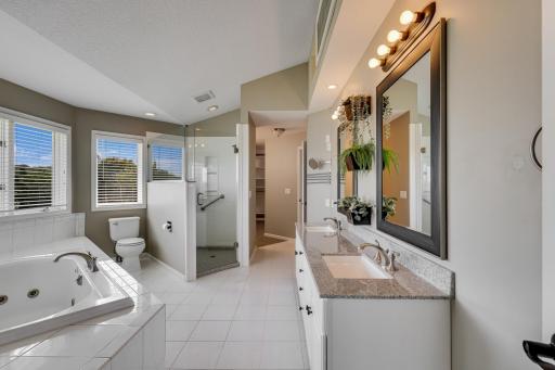 Wake up to water views and a cozy fireplace glow.