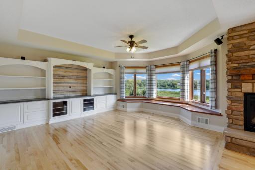 Serene pond views framed by oversized windows.