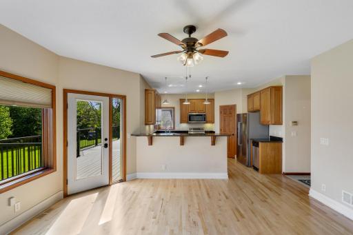 Bright kitchen with granite counters & stainless appliances.