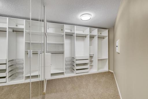 Massive walk-in closet with built-in organization.
