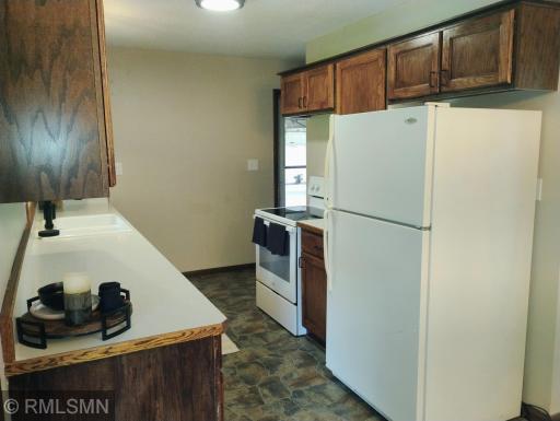 Tidy Galley kitchen with everything close