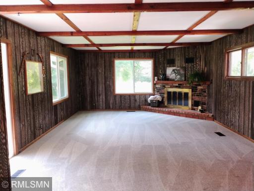 24x15 main floor family room with real wood fireplace for cozy family time!