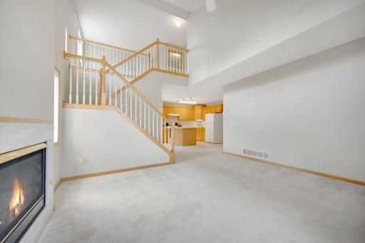 Open floor plan, amazing staircase with upper level loft