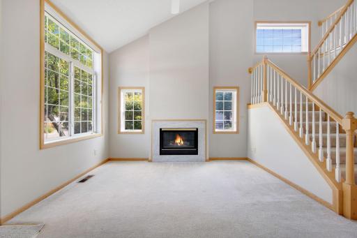 open and bright family room with gas fireplace