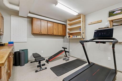 Storage/Exercise Room w/Cabinets & Workbench!