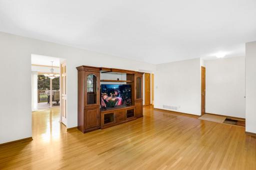 Beautifully finished hardwood floors span the main level which boasts 3 bedrooms, a full bathroom, and a spacious and bright living room.