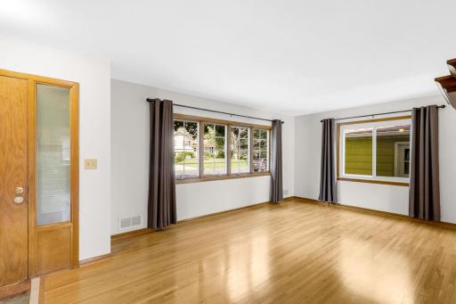 Beautifully finished hardwood floors span the main level which boasts 3 bedrooms, a full bathroom, and a spacious and bright living room.