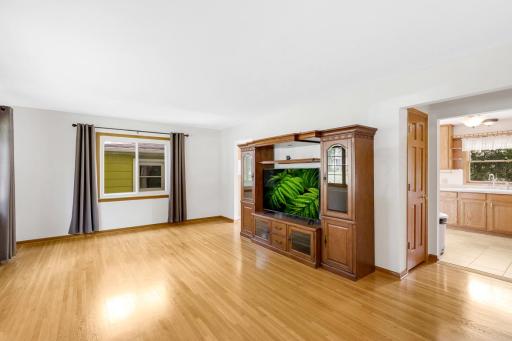 Beautifully finished hardwood floors span the main level which boasts 3 bedrooms, a full bathroom, and a spacious and bright living room.