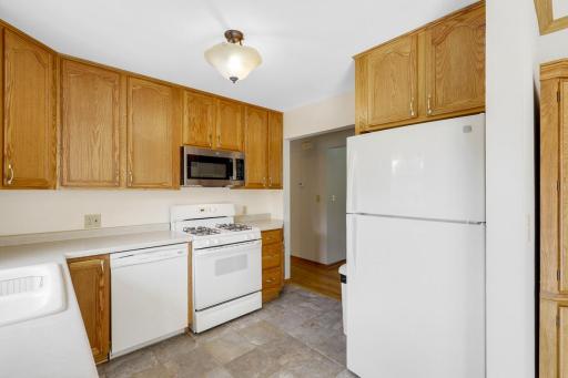 The kitchen is open to the dining room and features east-facing windows which invite morning sun to fill the space.