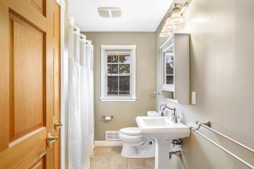 The main-level full bath serves the 3 main-level bedrooms and common spaces.