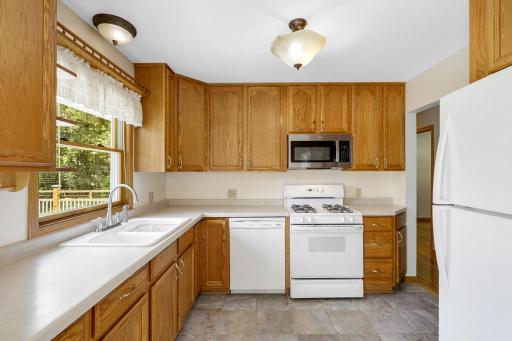 The kitchen is open to the dining room and features east-facing windows which invite morning sun to fill the space.