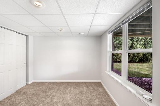 This lower-level bedroom is the 4th of 4 total bedrooms.