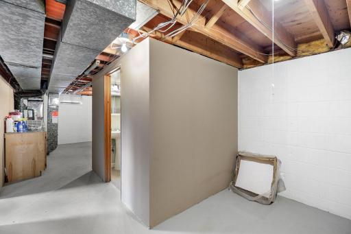 The lower level also offers ample storage space with a dedicated storage room and a large utility/laundry space.