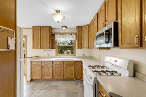 The kitchen is open to the dining room and features east-facing windows which invite morning sun to fill the space.