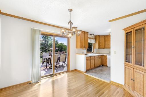 The dining room, bright and open to the living room, provides access to the deck and backyard space.