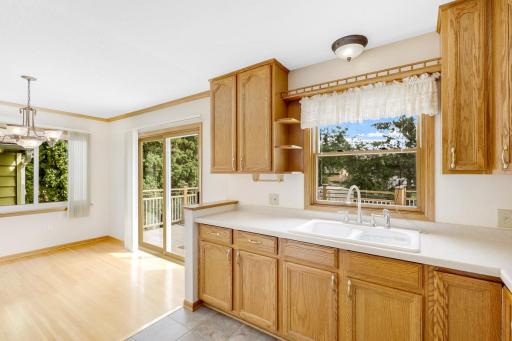 The kitchen is open to the dining room and features east-facing windows which invite morning sun to fill the space.