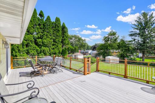 The large, low-maintenance deck, located just off the dining room, offers the perfect place for entertaining guests and for catching morning sunshine.