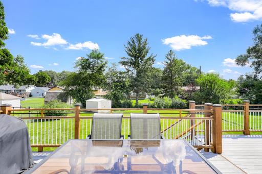 The large, low-maintenance deck, located just off the dining room, offers the perfect place for entertaining guests and for catching morning sunshine.