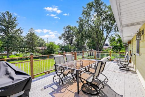 The large, low-maintenance deck, located just off the dining room, offers the perfect place for entertaining guests and for catching morning sunshine.