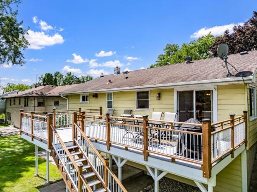 The large, low-maintenance deck, located just off the dining room, offers the perfect place for entertaining guests and for catching morning sunshine.