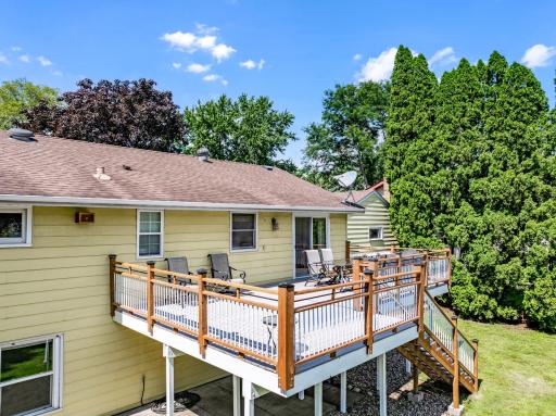 The large, low-maintenance deck, located just off the dining room, offers the perfect place for entertaining guests and for catching morning sunshine.