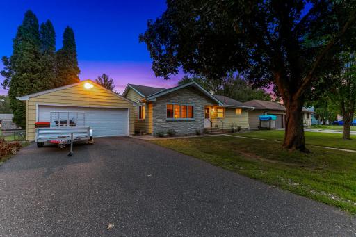 The exterior features low-maintenance stonework and steel siding.