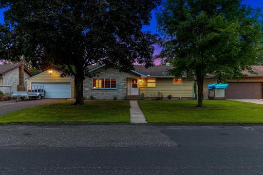 The exterior features low-maintenance stonework and steel siding.