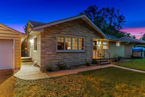 The exterior features low-maintenance stonework and steel siding.