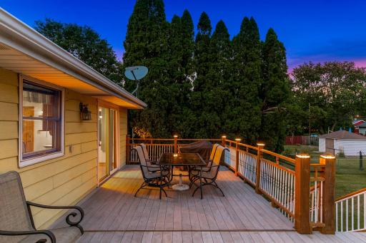 The large, low-maintenance deck, located just off the dining room, offers the perfect place for entertaining guests and for catching morning sunshine.
