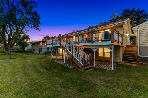 The large, low-maintenance deck, located just off the dining room, offers the perfect place for entertaining guests and for catching morning sunshine.