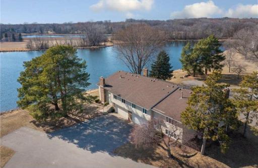 Kayak in the summer and ice skate in the winter. This is a destination home complete with magnificent sunset views dancing across the water
