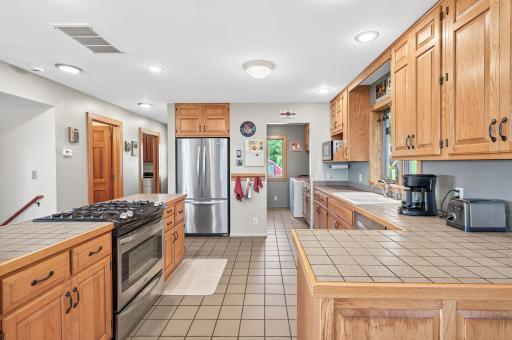 View of the kitchen that show the walk in pantry.